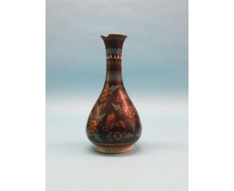 A 19th century Japanese cloisonne enamel vase, waisted bulbous form with bright floral designs against a black ground, painte