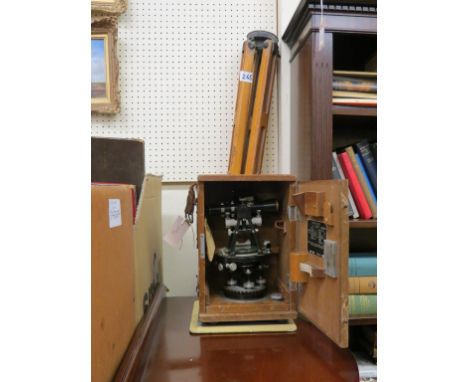 A Japanese 2in. surveyor's Dumpy level, with integral compass, in case, dated 1955, and a surveyor's folding wood tripod stan
