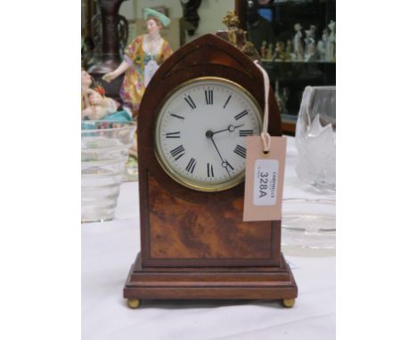 An Edwardian mahogany mantel clock, enamelled dial with Breguet hands, French timepiece movement, with key, lancet case with 