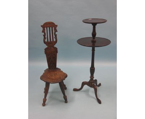 A late Victorian carved oak spinning chair, and a reproduction mahogany two-tiered wine table, on tripod base