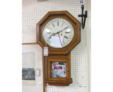 An octagonal drop-dial wall clock, enamelled dial with date-ring, 24in. high, and a mantel clock with printed circular dial, 
