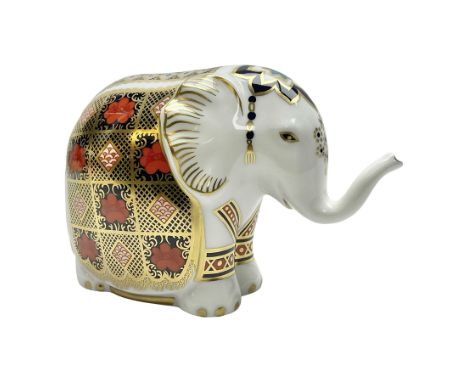 Royal Crown Derby paperweight, Elephant, printed in the 1128 pattern, trunk raised, gold stopper, H10cm