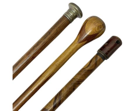 Three early 20th century walking sticks, to include a smoking pipe walking stick, the cane opening to reveal a concealed pipe