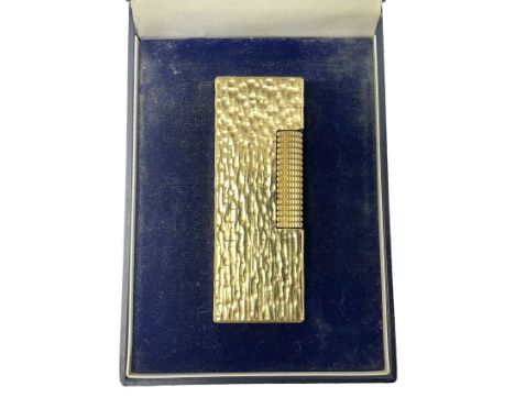 Dunhill gold plated lighter with textured bark effect decoration, in fitted case