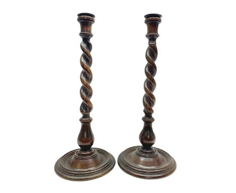 Pair of early 20th century Barley Twist oak candlestick, H43cm