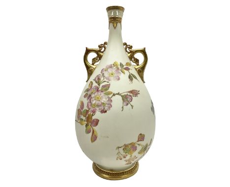 Royal Worcester, blush ivory twin handled vase, the bulbous body decorated with hand painted flowers, the tall tapering neck 