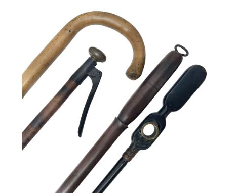Two late 19th century fruit picker canes, the first example a French ebonised bamboo cane, with pair of fruit scissors to bas