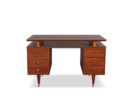 A 1950s GIO PONTI DESK, with six drawers, on brass feet, with a certificate of authenticity from the Gio Ponti Archives. 76cm