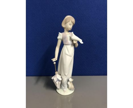 A collection of Lladro and Nao figures comprising, Lladro 'Gone