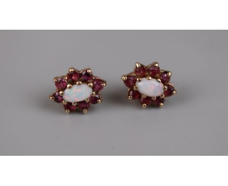 Pair of gold opal and ruby earrings 