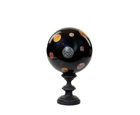 Black marble sphere with samples of inserted marbles. ADDITIONAL PHOTOS, INFORMATION OF THE LOT AND SHIPPING INFORMATION CAN 