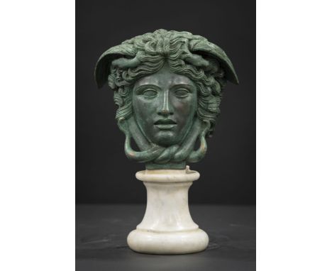 Eye-catching Medusa Rondanini in bronze on a base in white statuary marble.Period first half of the 20th century. ADDITIONAL 