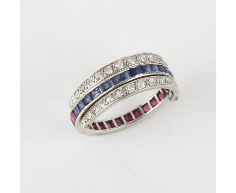 Day and night flip ring, eternity band half set with rubies and half with sapphires, with flip diamond half eternities either