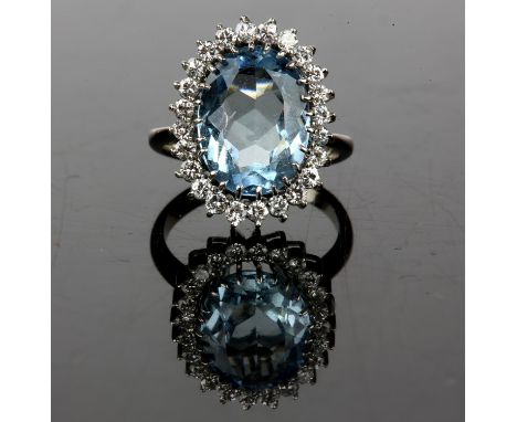 Aquamarine and diamond cluster ring, oval cut aquamarine weighing an estimated 4.75ct, surrounded by twenty-four round brilli