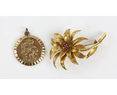 Ruby floral brooch and St Christopher pendant, a flower brooch with seven rubied in stamped 18ct gold together with a stamped