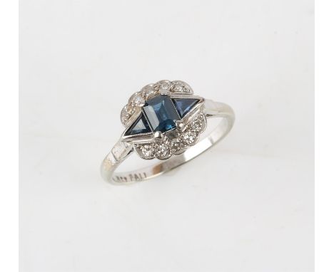 Art deco and sapphire ring, central baguette cut sapphire with two trilliant cut sapphires either side, bordered by round bri