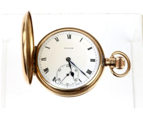 Rolex, a gold hunter pocket watch the signed white enamel dial with Roman numeral hour markers within a railway minute track,