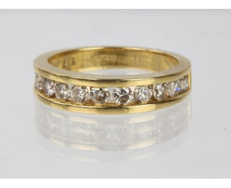 A diamond half eternity ring, round brilliant cut diamonds, channel set in 18ct yellow gold, size MCondition Report:  Gross w