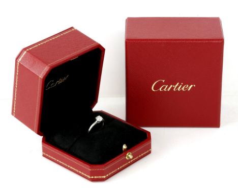 Cartier single stone diamond ring, round brilliant cut diamond weighing 0.61 carat, four claw set in platinum, ring size L, w