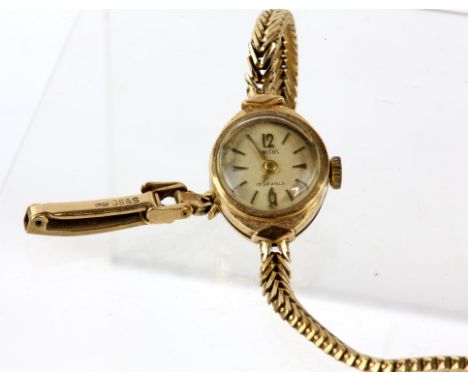 Smiths, a Ladies Gold wristwatch, The signed dial with baton hour markers, fitted with an unsigned 15 jewel manual wind movem
