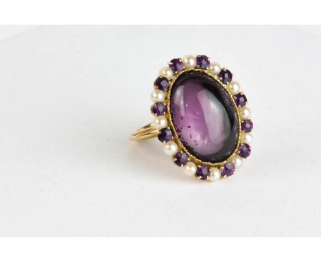 Amethyst and pearl ring, oval cabochon amethyst surrounded by alternating pearls and amethysts, set in tested 18ct, ring size