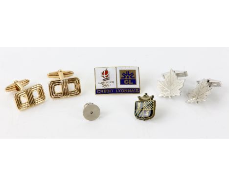 Pair of Christian Dior cufflinks, a pair of silver maple leaf cufflinks, an Yves Saint Laurent tie pin, and two othersConditi