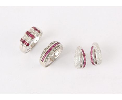 Two 18ct ruby and diamond rings with matching earrings, a two row baguette cut ruby and round brilliant diamond ring, ring si