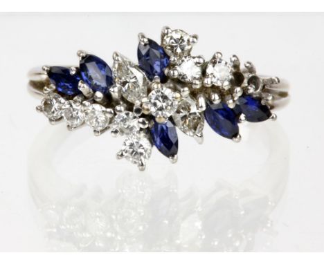 Sapphire and diamond cluster ring, in a spray design set with marquise cut sapphires and round cut and marquise cut diamonds,