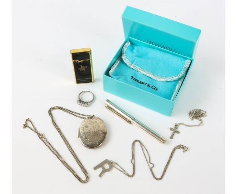 Tiffany & Co silver mini ball point pen, length 90mm, with pouch and box, an oval locket pendant, 42 x 32mm, on a curb link c