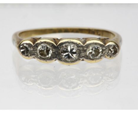 Five stone diamond ring, five round brilliant diamonds graduating in a rub over setting, ring size M, set in stamped 18ct Con