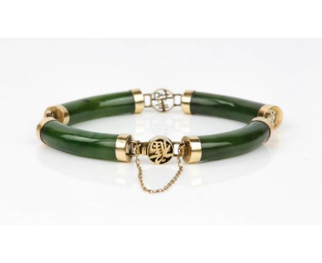 Jade and stamped 14ct bracelet set with 4 cylindrical jade panels and 14ct Asian characters, with a safety chainCondition Rep