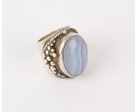 Silver ring by Michael A Bolton, set with an oval blue banded agate stone, and a garnet set underneath, approximate ring size