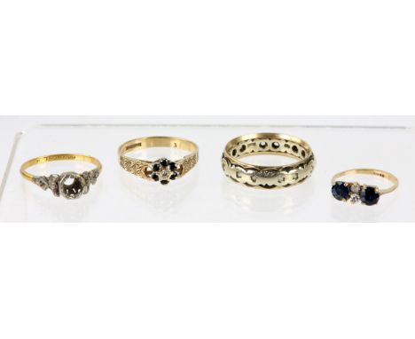 Three gold rings, including a band ring set with paste stones, size Q, a sapphire and diamond ring set with two round cut sap