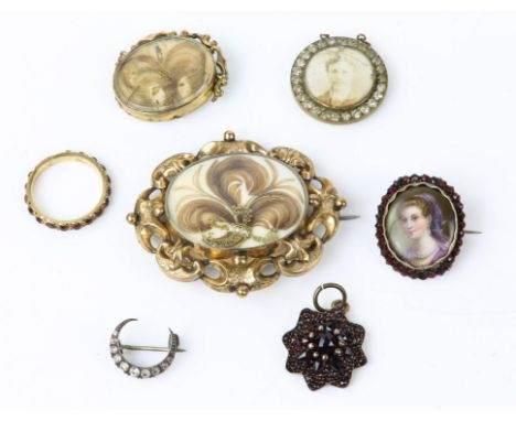 Four mourning brooches, two set with hair in tested 9ct, and two with portraits set in base metal, together with a tested 9ct