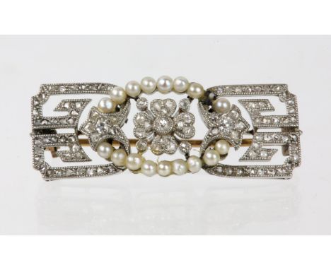 An Art Deco diamond and seed pearl brooch, with rose cut diamonds, set in platinum with a 9ct gold pin, 3cm long by 1cm wide 