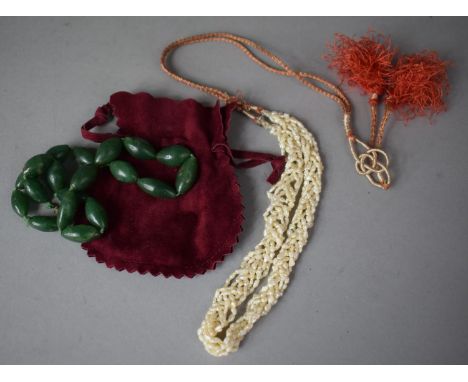 A String of Jade Ovoid Beads with Barrel Clasp together with a String of Oriental Pearls on Embroidered Silk Tassel 