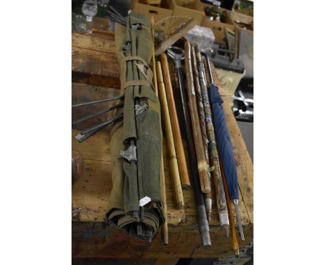 A Collection of Various Walking Sticks to include Enamelled Mounted Examples, Swagger Stick, Bamboo Examples, Shooting Stick,