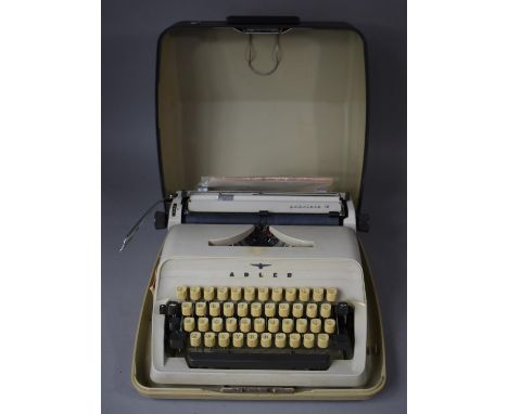 A Vintage Cased Portable Adler Typewriter 