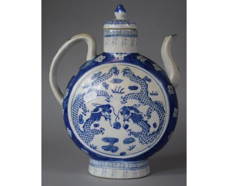 An Oriental Blue and White Moon Flask Teapot, Decorated with Dragons Chasing Flaming Pearl, 32cms High 