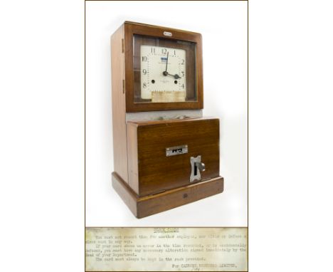 'CLOCKING IN' CLOCK, by National Time Recorder Co. Ltd., polished wood case with typewritten note by 'Cadbury Brothers Limite