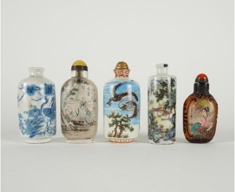 FIVE CHINESE SNUFF BOTTLES (5)Late 19th/20th century Comprising; three cylindrical porcelain bottles painted with figures a l