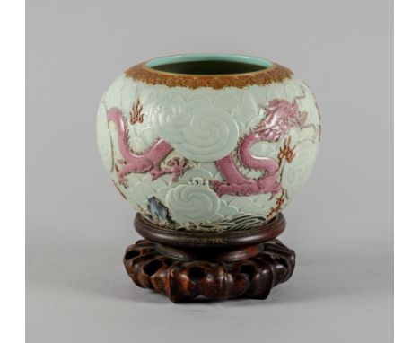 A GOOD CHINESE FAMILLE-ROSE VASEQianlong seal mark but 19th century Of compressed globular for, the sides crisply moulded wit