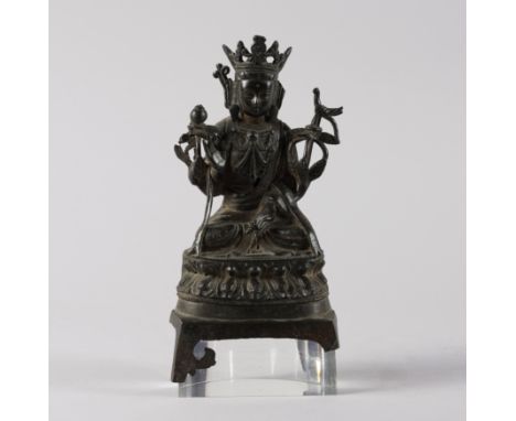 A CHINESE BRONZE FIGURE OF A BODHISATTVAMing dynasty, 16th/17th century Seated in vajrasana on a double lotus with right hand