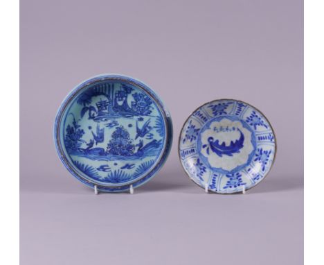 A PERSIAN POTTERY POTTERY BLUE AND WHITE SHALLOW BOWL17th/18th century Painted to the interior with two recumbent deer and tw