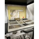 Flatware: German SBs Bestecke Solingen, chrome nickel steel cutlery set with gold plated highlights.