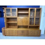 Mid 20th cent. G-Plan teak effect wall units including glazed display cabinet over three drawers,