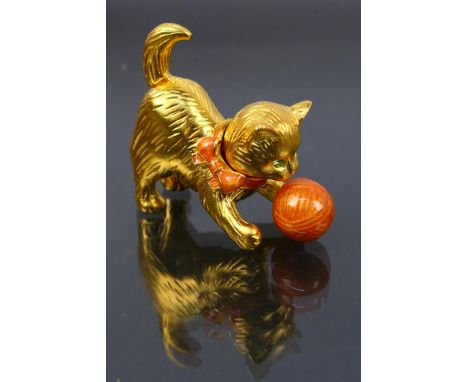 Estee Lauder - A boxed gilt metal Estee Lauder solid perfume compact in the form of a cat. Compact cat has green crystal eyes