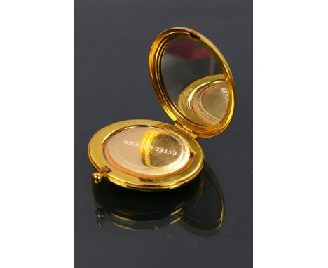 Estee Lauder - An Estee Lauder translucent pressed powder compact. Made in USA. Built in mirror. Length when extended is 10 c