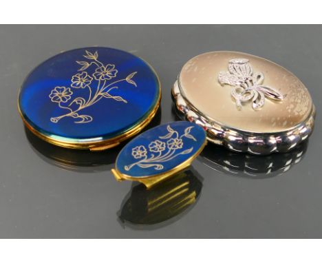 Kigu - 2 x boxed vintage Kigu Compacts, a Convertible Compact with hand engraved floral design on a blue background and a sil