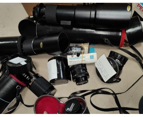 A selection of lenses and photography accessories:&nbsp; a Praktica 5.6 f400 lens and others 